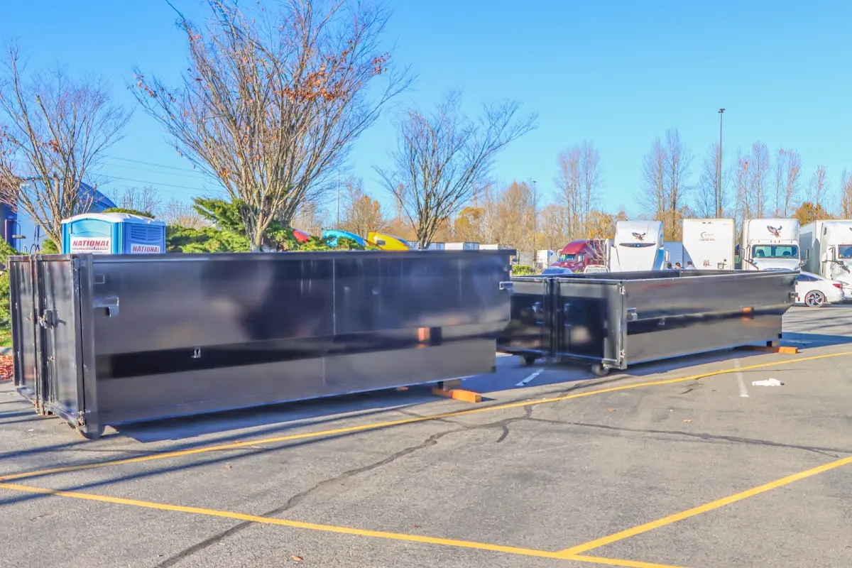 Professional dumpster rental service with roll-off container on residential driveway in Glenn Heights